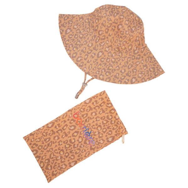 Two items with a leopard print design. The top item is a bucket hat with a wide, downward-sloping brim. Below it is a flat pouch with a rectangular shape and a zipper on one edge. Both items feature a consistent leopard print pattern with a tan background and dark brown and black spots.