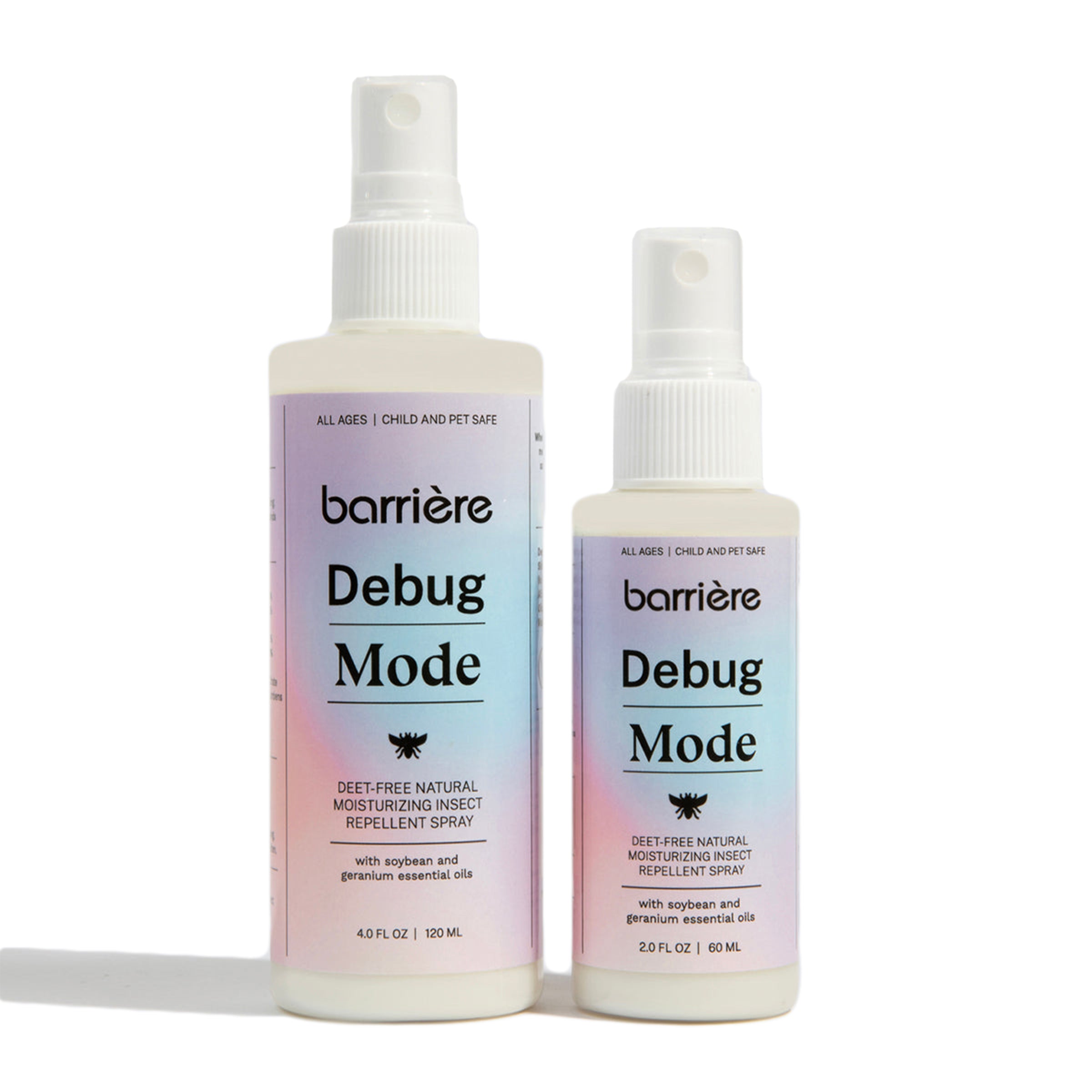 Two bottles of "Debug Mode" insect repellent spray by Barrière, one larger and one smaller. Both bottles have a gradient design in pastel hues of purple, pink, and blue, with the product name and brand logo clearly visible. The labels read "DEET-Free Natural Moisturizing Insect Repellent Spray" along with "with superior natural essential oils." Both bottles feature a spray nozzle on top, with the larger bottle on the left and the smaller bottle on the right. The background is a clean white surface.